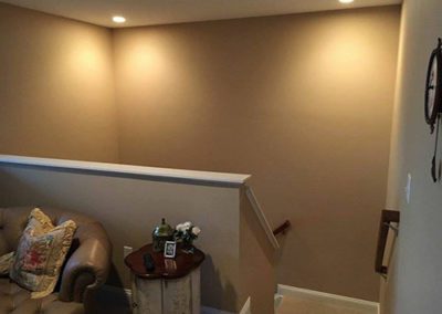 a stairway area with new painted brown walls