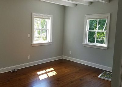a room with newly painted gray/blue walls