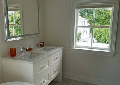 Bathroom with white painted walls
