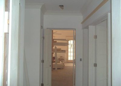 a hallway painted with a white color