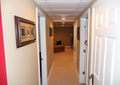 a finished basement with peach colored walls