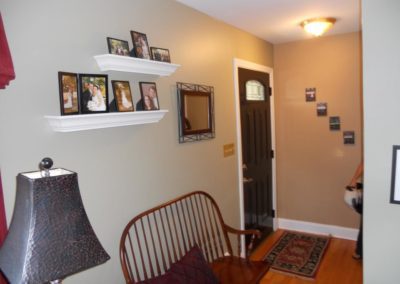 A Painted Hallway with pictures on the wall