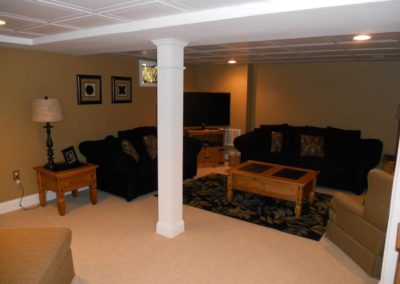 A finished basement, with furniture
