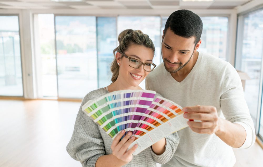 Man and Woman looking at paint samples